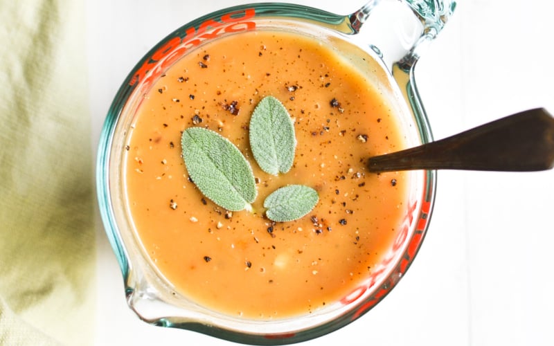 Cider sage gravy, in a cup.