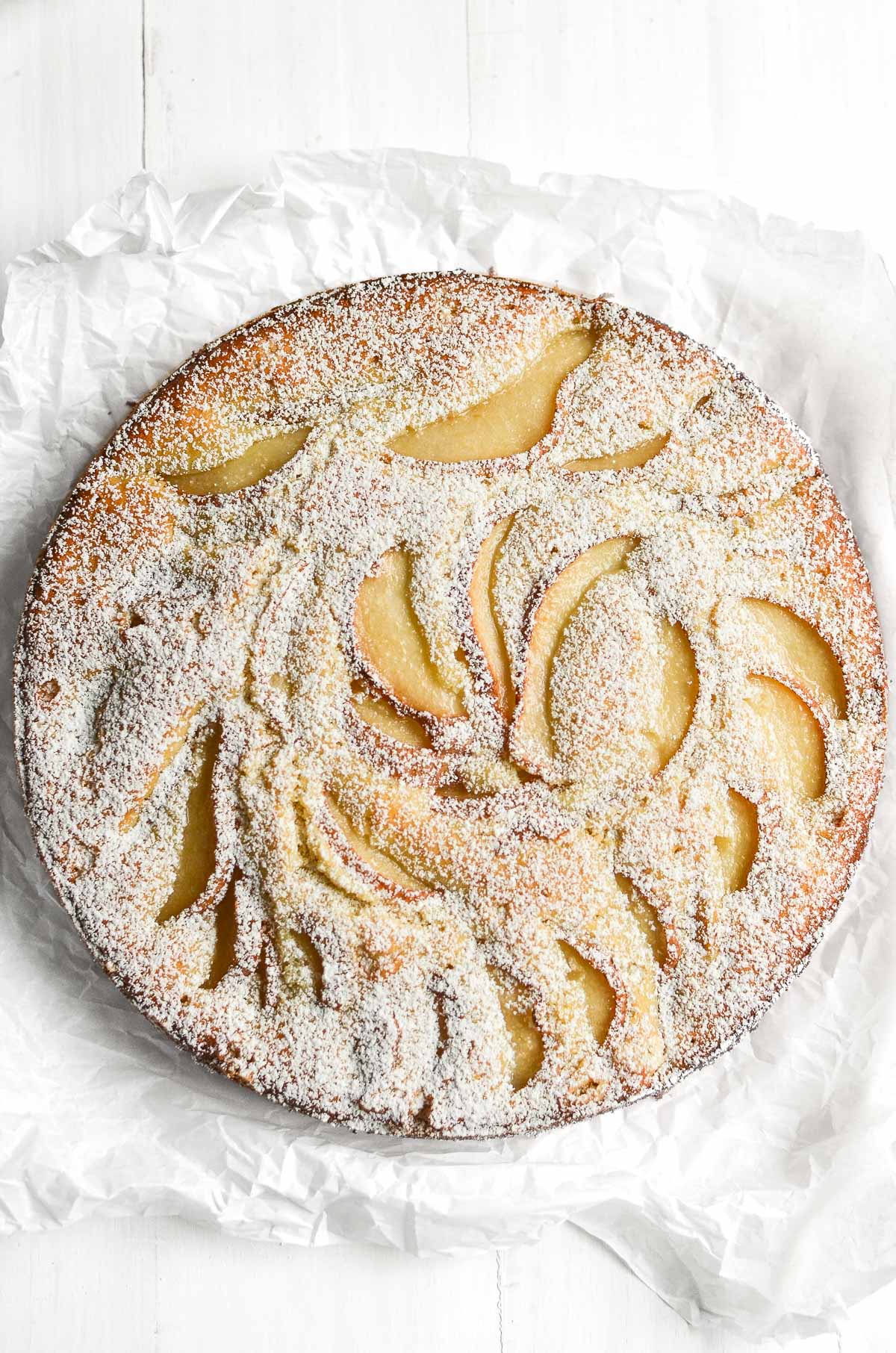 Fresh Ginger and Pear Cake on a piece of white parchment paper.