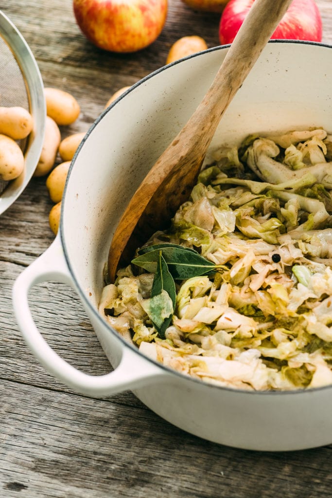 Brown cabbage in a white pot