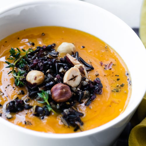 a small bowl of wild rice and carrot soup