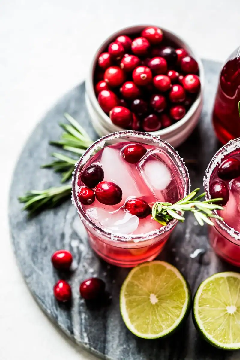 Do you have a signature Thanksgiving cocktail? ย If not, you might find some inspiration below. ย I love to start off the holiday with a house cocktail offered to each guest as they walk in the door. #Thanksgiving #cocktail #bartending #alcohol #mulledwine #cranberrycocktail #pumpkincocktail #fallcocktail #drinks #beverages #pomegranate #recipe cranberry margaritas