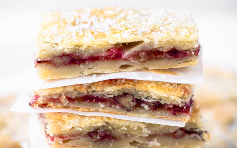 a stack of rugelach bars with sparkling sugar