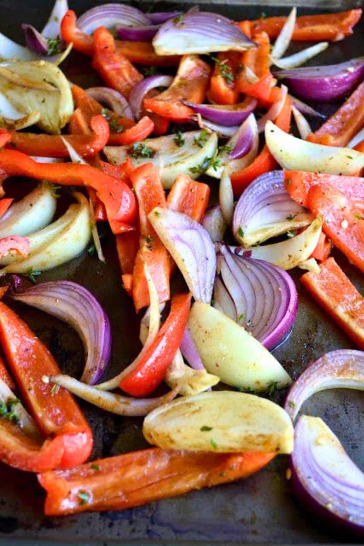 Red Pepper and Baked Egg Galettes from Jerusalem (the book) ~ these eggs baked in puff pastry are the ultimate breakfast in bed recipe! #eggs #breakfast #brunch #puffpastry #bakedeggs #breakfastinbed #mothersday #valentinesday #Christmasbreakfast #holidaybreakfast #ottolenghi #jerusalem roasting veggies for red pepper and egg galettes.