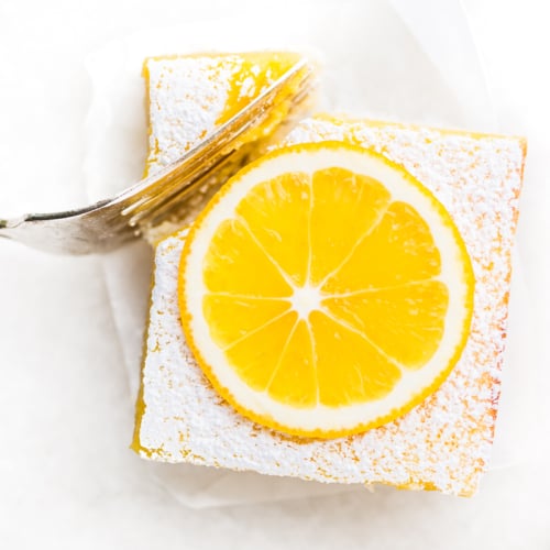 taking a bite of a Whole Meyer Lemon Bar