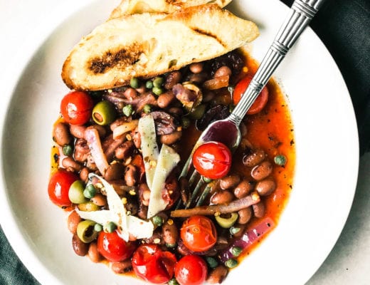 Puttanesca style beans and toast in a bowl