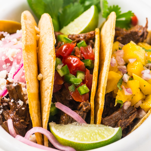 Instant Pot Barbacoa tacos in a white bowl