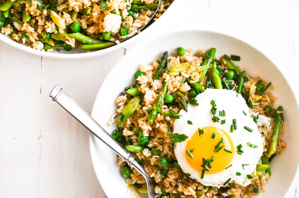 fried rice in bowls with fried egg