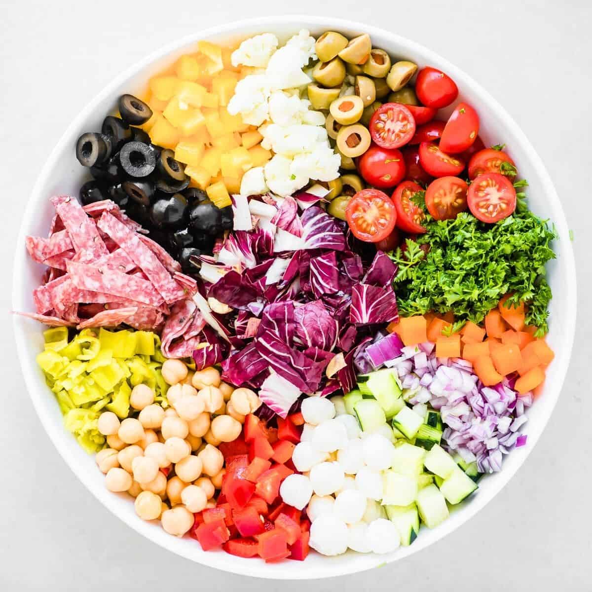 Colorful Chopped Italian Salad composed in a white salad bowl.