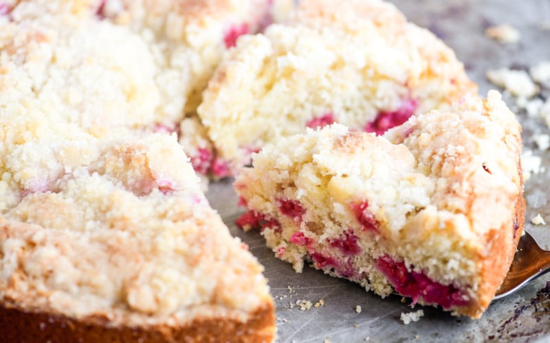 Taking a slice of raspberry coffee cake