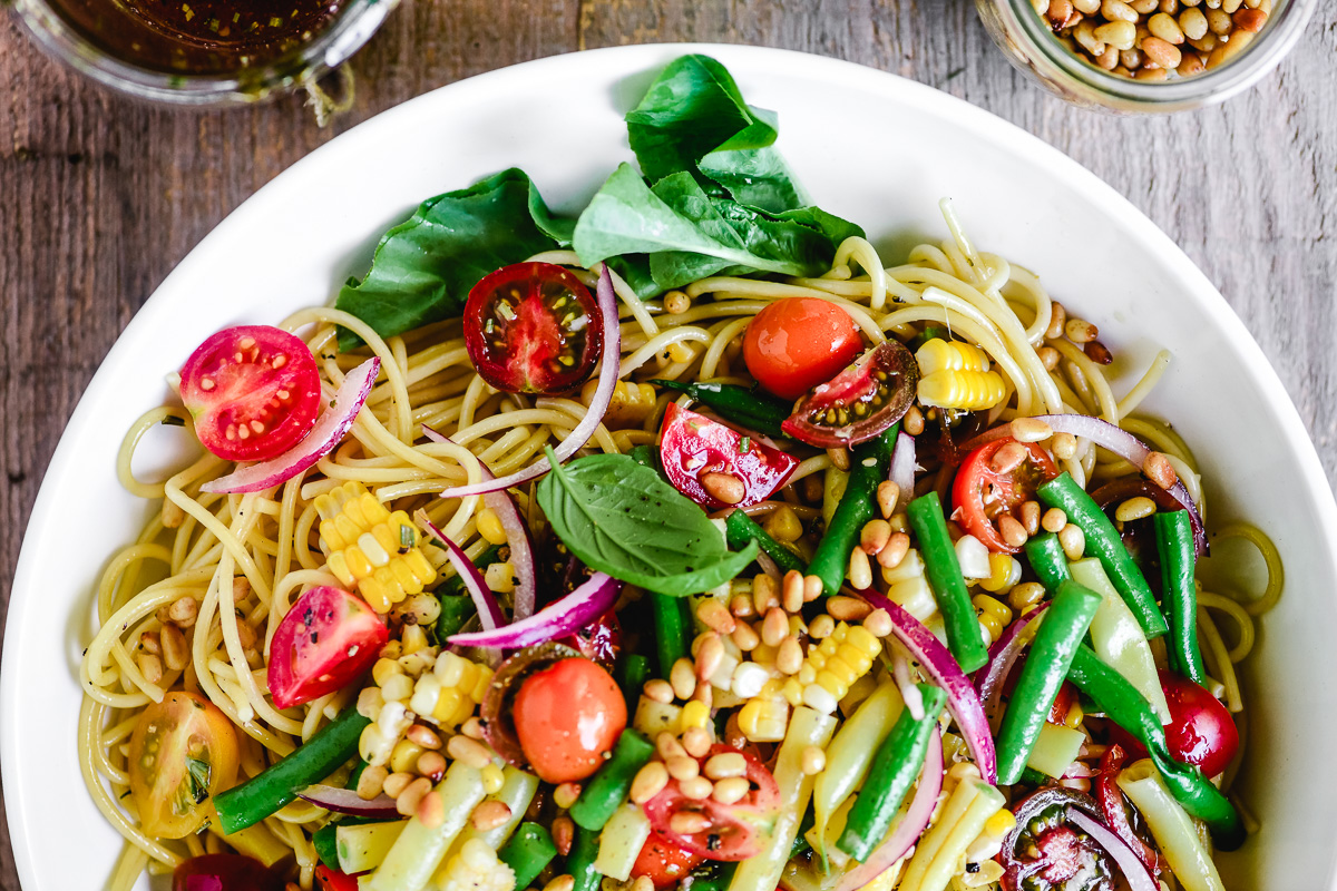 spaghetti salad in a white bowl
