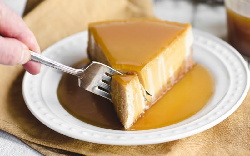 Taking the first bite of a maple cheesecake