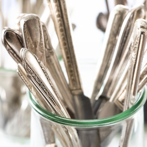 silverware in a glass jar