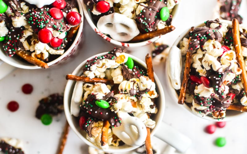 holiday popcorn mix in mugs