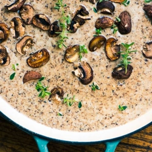 mushroom and Brie soup in a Dutch oven.