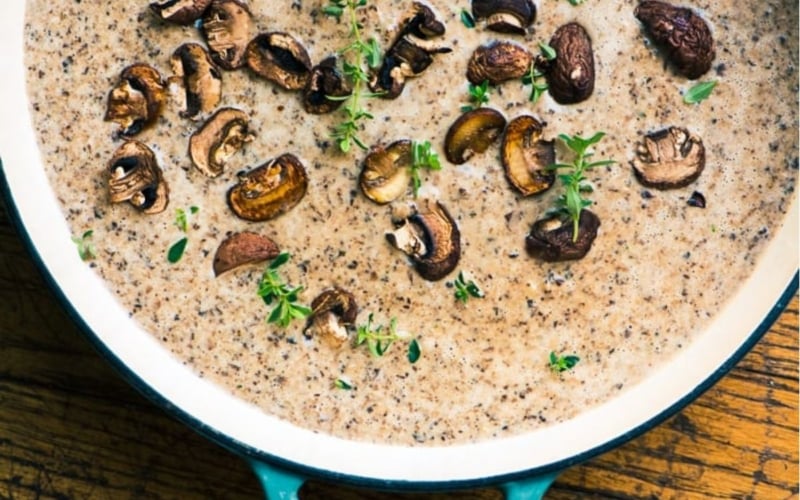mushroom and Brie soup in a Dutch oven.