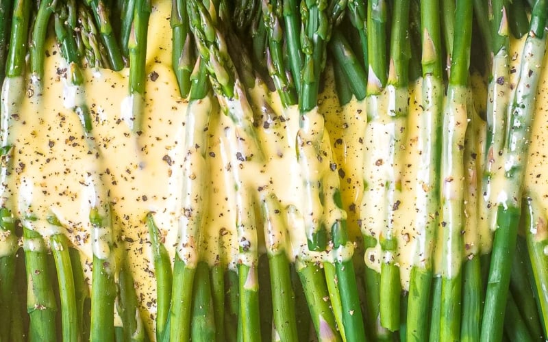 Hollandaise sauce on asparagus.