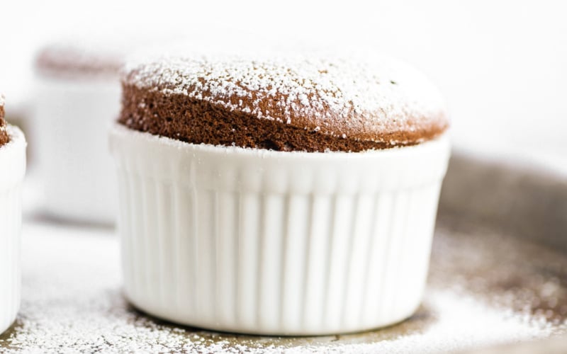 chocolate soufflé in a white ramekin