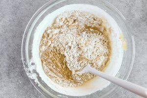 folding flour into carrot cake batter