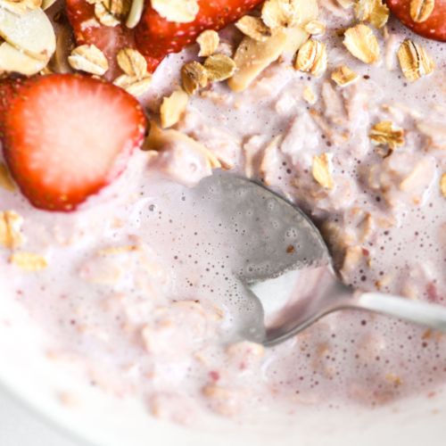 strawberry milk muesli with spoon