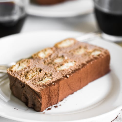 a slice of Nutella Tiramisu cake on a white plate