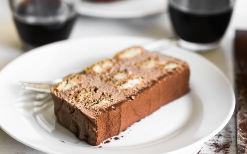 a slice of Nutella Tiramisu cake on a white plate