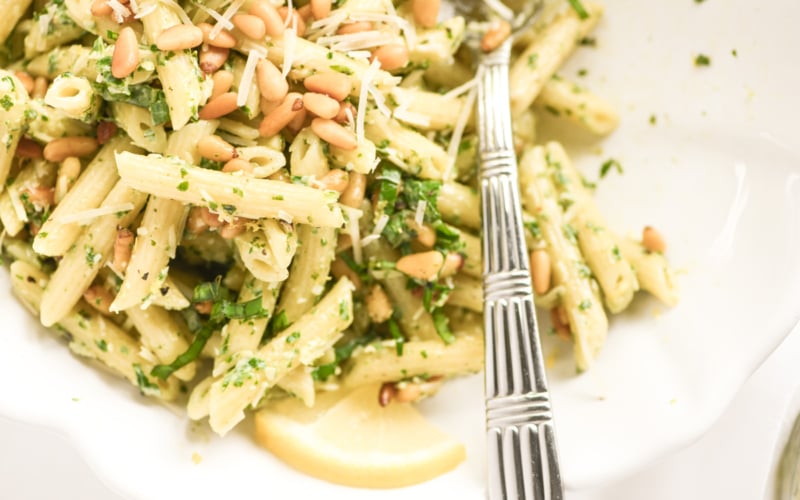 lemon basil pasta salad in a bowl with serving spoon