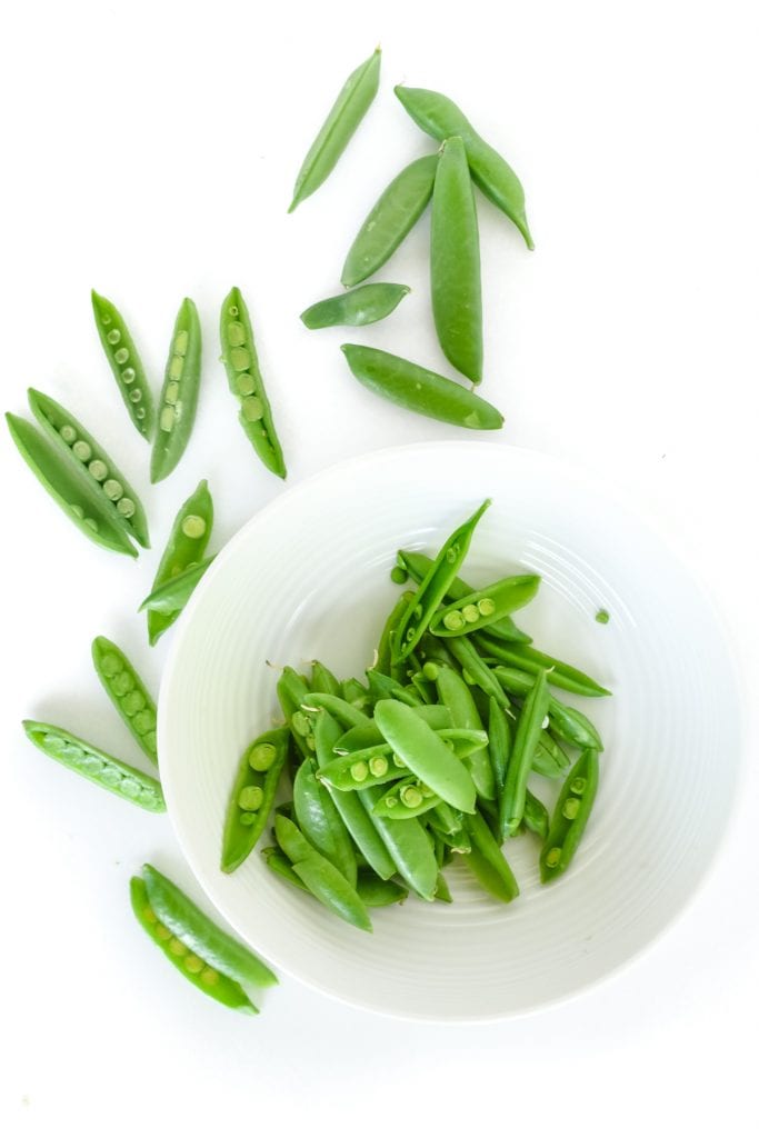 slicing snap peas for Thai chicken salad.