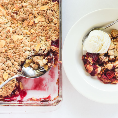 easy cherry almond crisp, in pan with ice cream