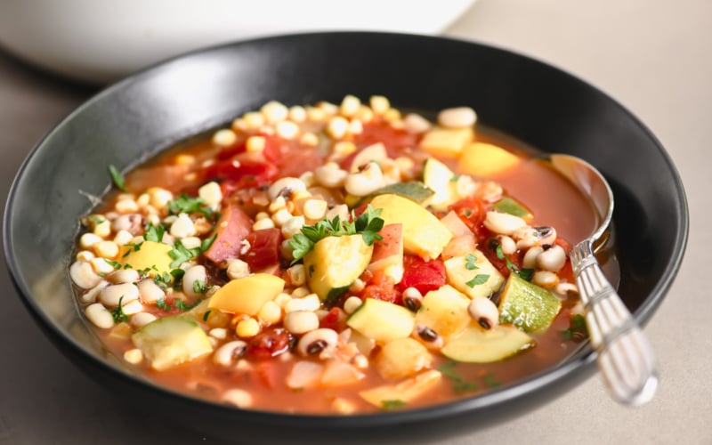 Three Sisters Soup in a black bowl