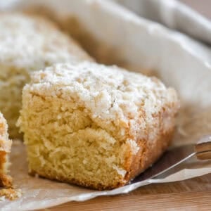 Taking a slice of cardamom crumb cake.
