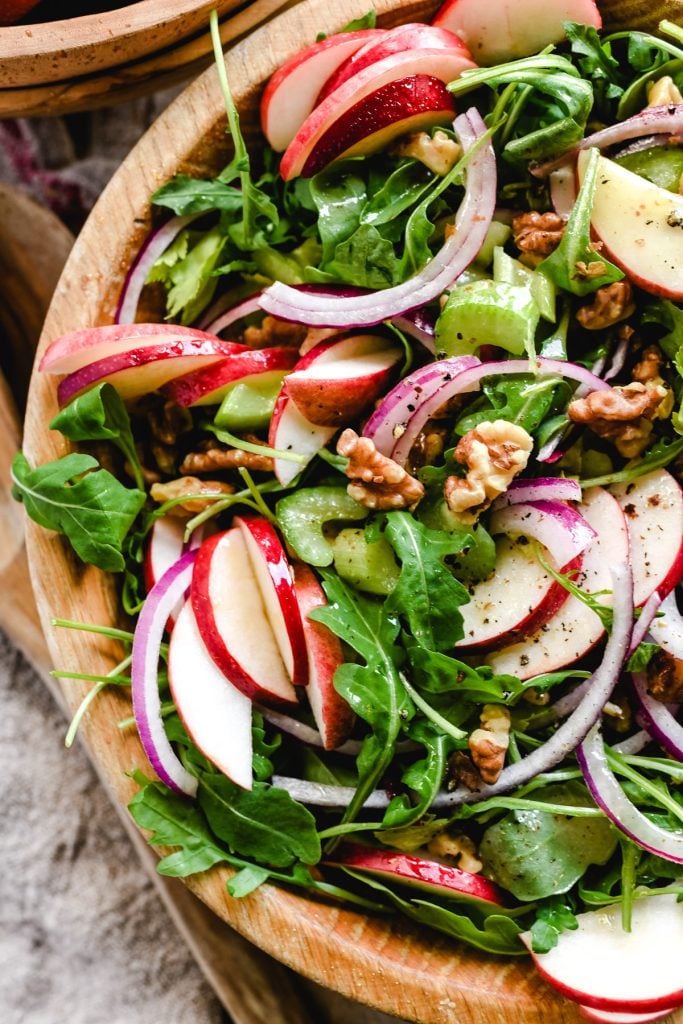 apple celery and walnut salad in a wooden bowl