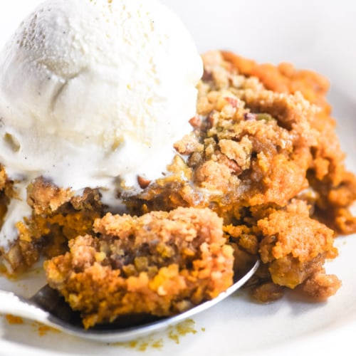 pumpkin Spice Crisp in a bowl with ice cream