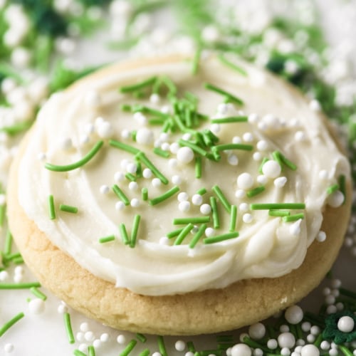 a cream cheese frosted sugar cookie with sprinkles