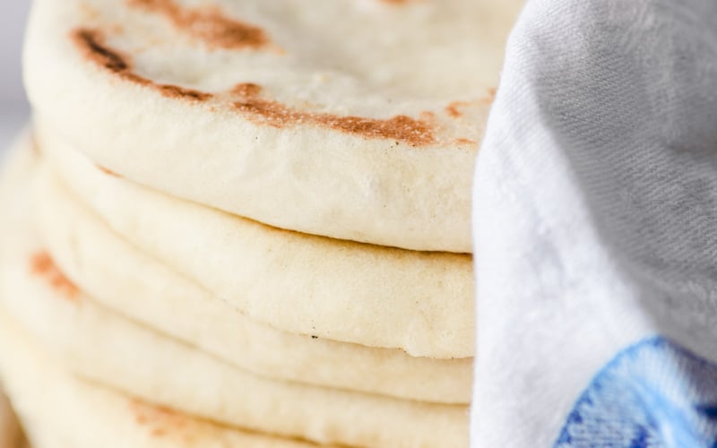 a stack of homemade pita bread
