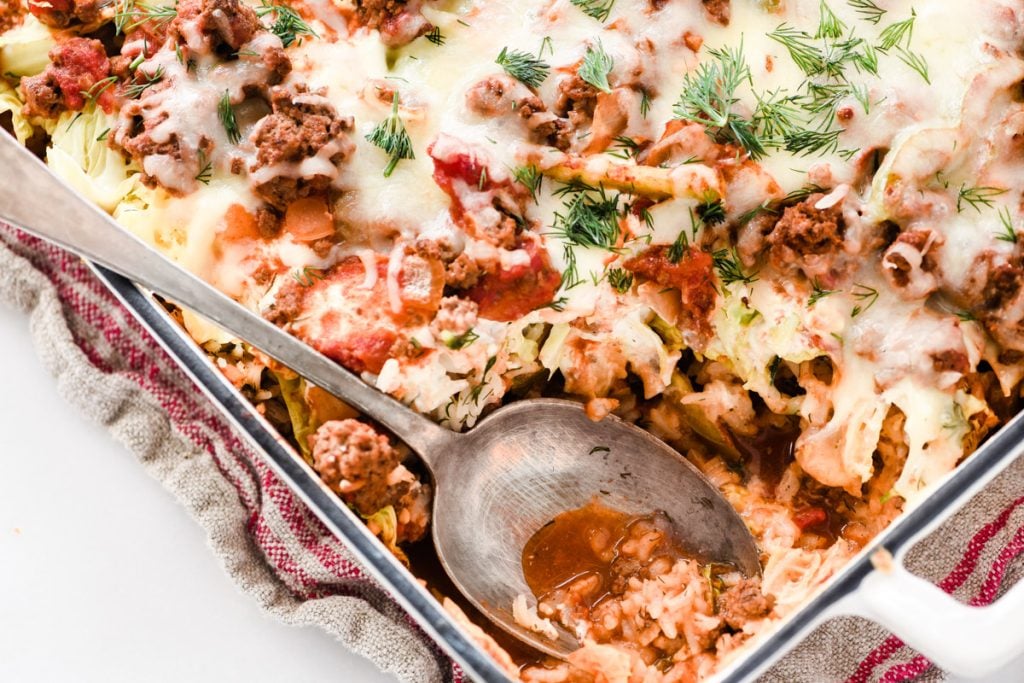 stuffed cabbage casserole with serving spoon