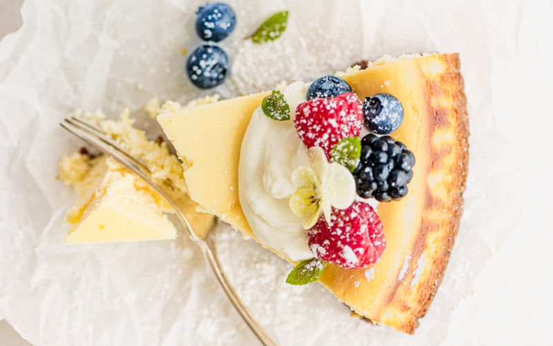 slice of lemon cheesecake with berries.