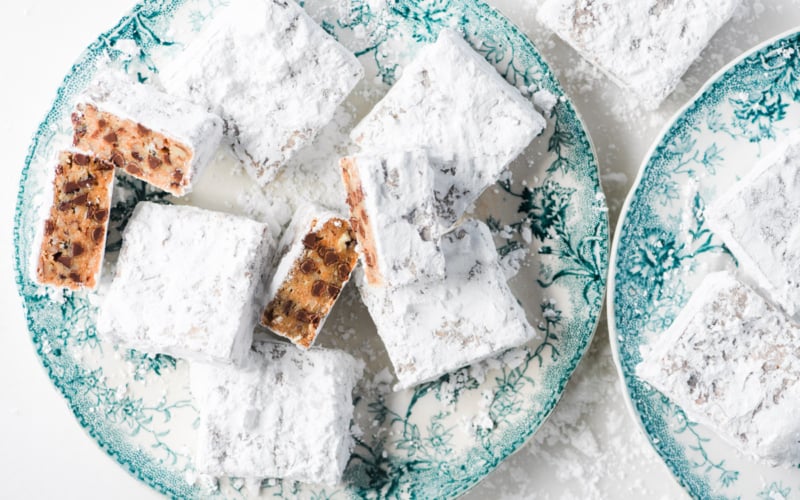Amish man bars on a plate, with one sliced in half