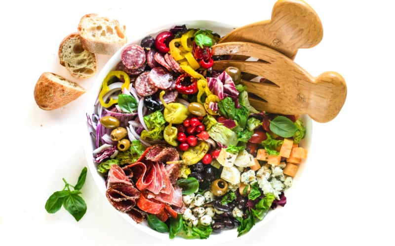 charcuterie salad with bread and basil