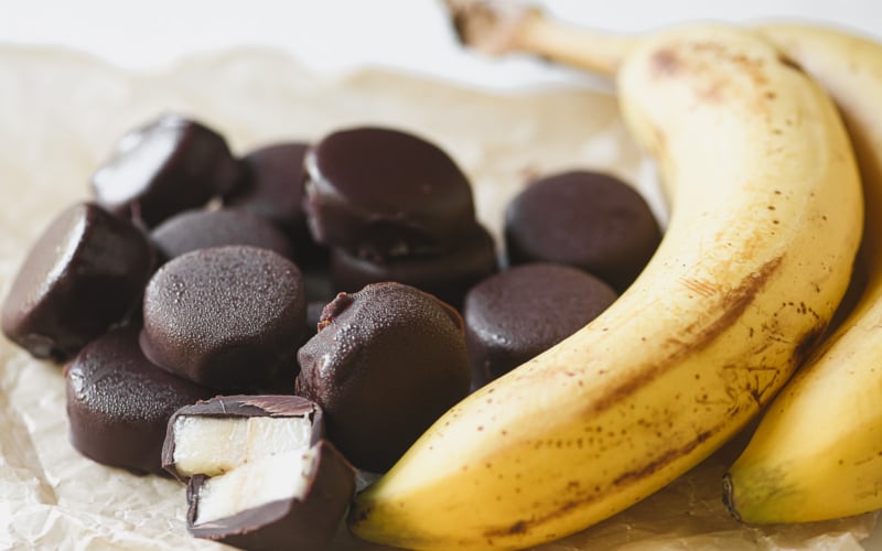 chocolate covered frozen bananas, copy cat Trader Joe's Gone Bananas on parchment paper