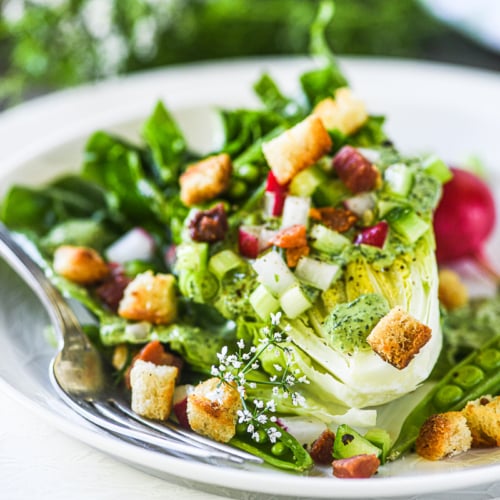 Green goddess wedge salad on a plate with fork