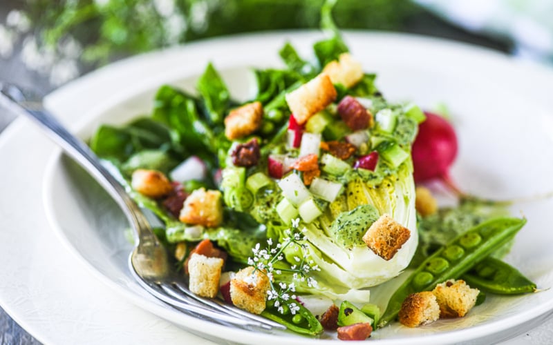 Green goddess wedge salad on a plate with fork