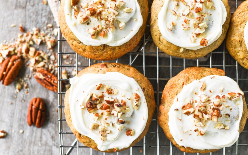 Crumbl copycat banana bread cookies on a rack with pecans