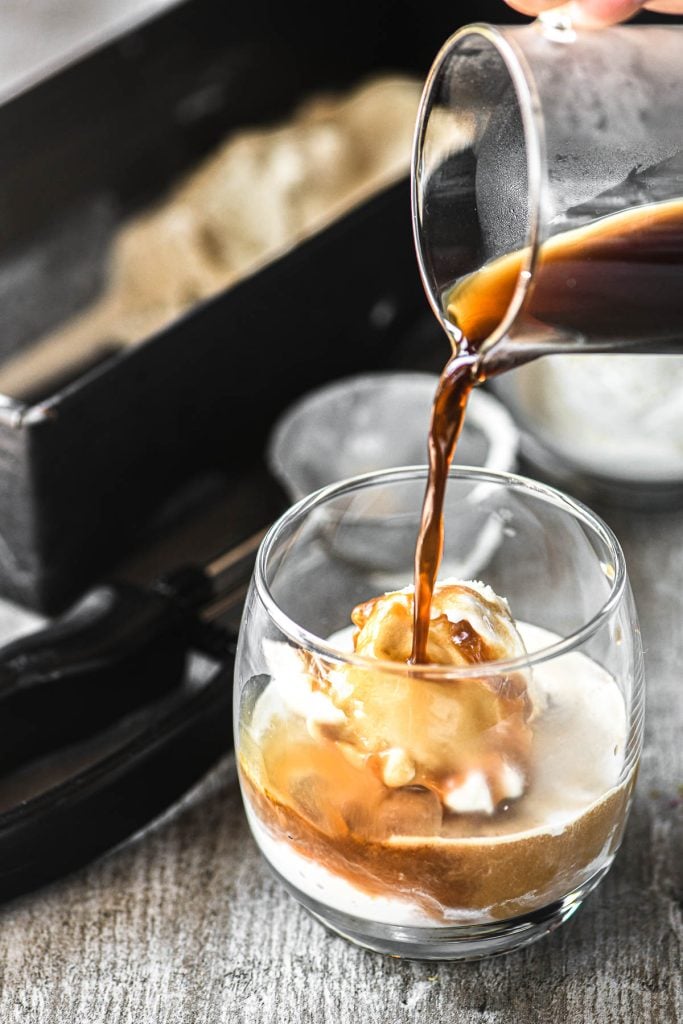 pouring a shot of espresso over cardamom affogato