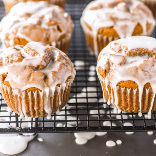 glazed gingerbread muffins on a rack