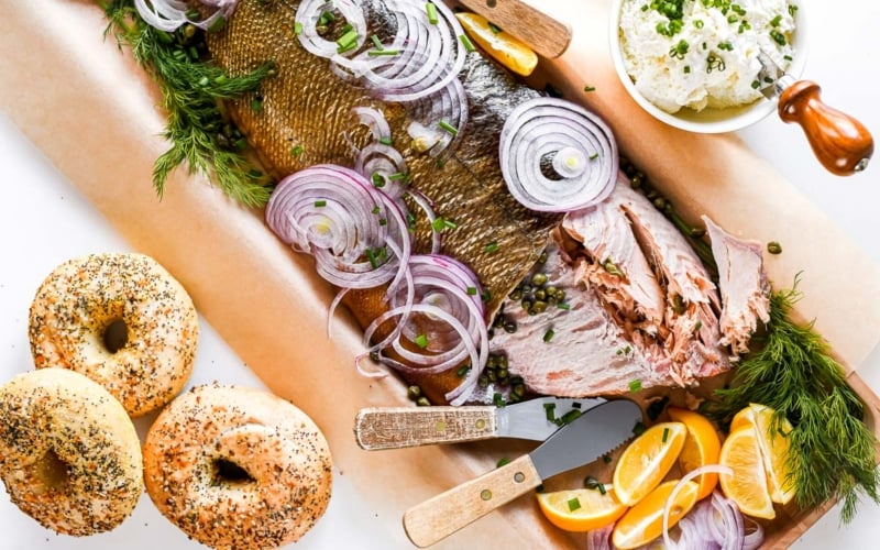 salmon brunch platter with bagels and cream cheese.