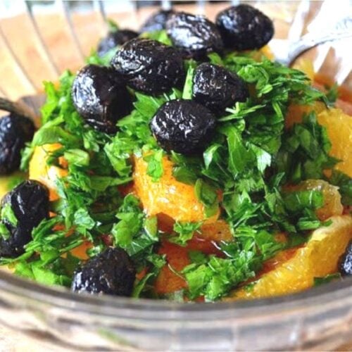 Moroccan orange salad in a glass bowl.