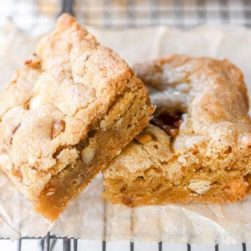 white chocolate pecan cookie bars, on a cooling rack.