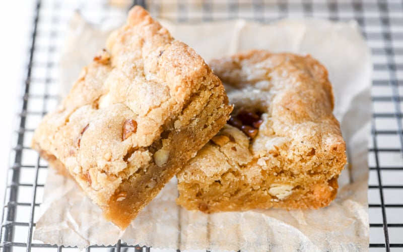 white chocolate pecan cookie bars, on a cooling rack.