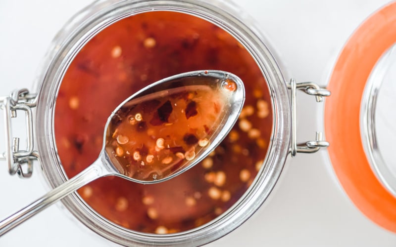 Sweet chili sauce recipe with spoon.