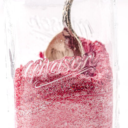 spoon in raspberry sugar.